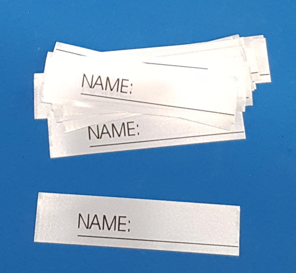 25 Stück Textiletiketten mit Aufdruck "Name_______" zum Beschreiben einzeln geschnitten.  