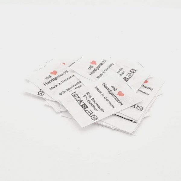 25 St. Textiletiketten mit Herz-Symbol Handgemacht - Made in Germany und Materialangabe