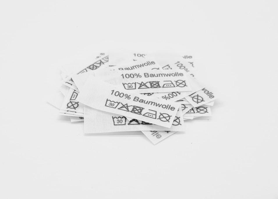 50 St. Textiletiketten 100% Baumwolle 3 P. Bügeleisensymbol 15x40mm